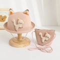 Detailed view of pink woven sun hat and crossbody bag set with cute 3D cat ears for kids - Pink Hat + Bag