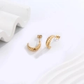 Close-up of 18K gold plated stainless steel croissant dome stud earrings on white waves - C-Shape Side Texture