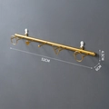 Golden wall-mounted coat rack with geometric hooks for entryways, 52cm width - Linear Geometric Hook