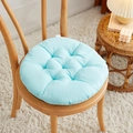 Round light blue quilted chair cushion with tufted design on a wooden dining chair - [Round] Aqua Green