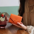 Slim orange genuine leather wallet with lychee texture and envelope button closure - Orange