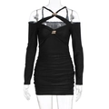 Detail of ruched black mini dress featuring cutout neck and metal ring accents - S / Black