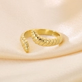Minimalist 18K gold plated croissant style snake ring on champagne silk background - Gold Spiral Twisted (KR111627-GC)