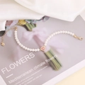 Elegant 18K gold plated pearl bracelet with a sparkling pink zircon heart pendant - Red