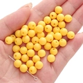 Matte yellow acrylic beads for DIY jewelry making held in hand for size visualization - 8mm/100pcs/approx 27g / Dark Yellow