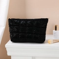 Portable black quilted cosmetic bag with high-capacity design and sleek glossy finish - Clutch Bag / Black