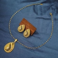 Macro detail of gold waterdrop hollow earrings and necklace on dark textured wood - E6107-5/Gold Waterdrop Textured Hollow