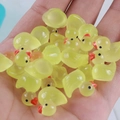 Handful of miniature yellow luminous resin ducks for DIY crafts and micro landscapes - Light Green