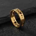 Minimalist gold titanium steel ring featuring a cutout heart design on gray slate - US 6 / Gold