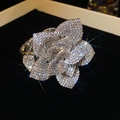 Macro view of adjustable floral ring with pavé diamond petals and twisted rope band texture - 3D Flower (Silver) / Silver