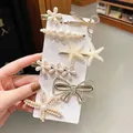 6-piece gold hair clip set featuring pearls, rhinestones, daisy and butterfly designs - Bowknot Starfish 7-Piece Set