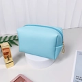 Light blue textured faux leather makeup bag with pearl initial and gold zipper pull - Small / Light Blue