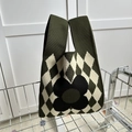 Olive green knitted tote bag featuring a white argyle pattern and a large black flower - Dark Green Argyle Small Flower