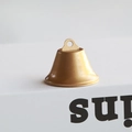 Close-up of a small golden metal bell with matte finish for Christmas DIY ornaments - 3.8CM / Gold