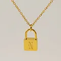 Minimalist gold lock necklace featuring a delicate chain and engraved letter N pendant - Letter N Style