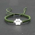 Detail of hand-woven green nylon rope bracelet with silver metal paw print charm - Army Green