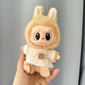 Labubu plush toy wearing a cream white fleece sweater with brown smiley face patch - White Smiley Face Polka Dot Shirt / First And Second Generation Keychains Are Compatible With La Cloth Dolls. Dolls Not Included.