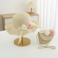 Detail of girls straw hat and matching purse set with lace trim and floral decorations - Hat And Bag / Beige