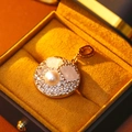 Vintage gold pendant with white base, crystals, and pearl in mustard velvet jewelry box - Round Rhinestone Pearl Style