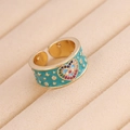 Detailed macro view of heart-shaped evil eye ring with blue enamel and colorful zircons - Adjustable Open / 6# Heart Blue