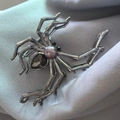 Detail shot of silver spider hair claw with purple pearl and teardrop gemstone on blue fabric - Large Spider Rhinestone Claw / Gunmetal