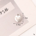 Detailed view of silver heart pendant on a card showing 1.2cm height and 0.9cm width - C287 09mm*12mm Silver Heart