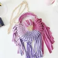 Detailed close-up of handmade crochet tassel bag featuring purple gradient fabric stripes - Purple & Pink Gradient