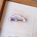 Macro detail of pink cloud mood tracker enamel pin with sliding heart and emojis - Cloud / Cloud Pink