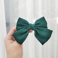 Elegant dark green satin bow hair clip held by hand with smooth fabric finish - Kids Duckbill Clip / Dark Green