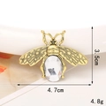 Detailed view of a gold alloy bee accessory with 3.5cm by 4.7cm size dimensions - Gold/Clear White Bee