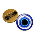 Front and back view of round blue glitter evil eye brooch pin with bronze metal base - Bronze-11