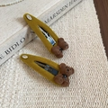 Detail of mustard yellow flocking bear hair clips with black bow on a vintage background - Green - Single Bear (BB Clip)