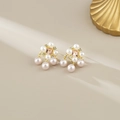 Elegant gold pearl earrings featuring a pink gemstone and cascading pearl drops - Stud Pin Style / Gold with Pink Pearl