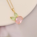 Close-up of golden necklace with a cute pink rabbit pendant on white ceramic plate - Rabbit Design Pink Main Stone (7#)