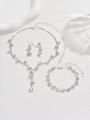 Detail view of a silver rhinestone jewelry set with necklace earrings and bracelet on silk - Rhinestone Necklace, Stud Earrings and Bracelet Set (483+747) / Silver