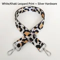 Detailed view of leopard print nylon strap with silver hooks and adjustable buckle - White Khaki + Silver Hook