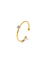Macro detail of gold-plated C-shaped ring featuring a bezel-set blue zircon stone - Light Blue