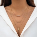 Three-layer gold necklace with small pearls, a metal bar, and a hammered round pendant - Gold-Pearl Round Disc Pendant
