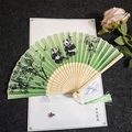 Chinese folding fan with green panda and bamboo print, hollow wood ribs and tassel - Panda Bamboo - Green