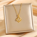 Elegant gold titanium necklace with a square cubic zirconia pendant on a jewelry box - Gold (8212)