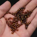 Silver-lined amber seed beads held in hand for DIY jewelry making and craft supplies - 4mm / 15g / Coffee