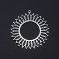 Detailed macro view of silver stainless steel sunburst pendant on a black matte surface - 3Pcs/Pack / Silver