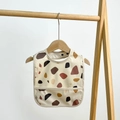 Waterproof baby bib in beige featuring a stylish terrazzo pattern and crumb catcher - Geometric Print