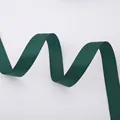 Detail of dark green polyester satin ribbon showing smooth texture and soft drape - Solid Christmas Green Ribbon (2.5cm Width 5m Length)