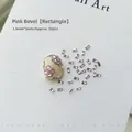 Close-up of 50pcs pink rectangular zircon nail gems with 1.5mm by 3mm dimensions - Pink Rectangle 1.5x3 (XY-1012)