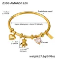 Detail view of a 18k gold-plated stainless steel bangle with heart and bear charms - Gold Heart Bear Charm Bangle