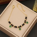 Golden bracelet with emerald green heart charms and beads in a beige jewelry box - 2# Bracelet