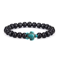 Elastic beaded bracelet featuring black glossy stones and a green turquoise turtle charm - Bright Black