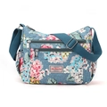 Floral print crossbody bag with multiple zippers and blue adjustable shoulder strap - Blue Background Bouquet