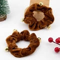 Close-up of brown velvet scrunchies with gold bells and festive Christmas decorations - Triple Bell Christmas Scrunchie Coffee